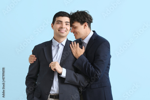 Married gay couple on blue ...