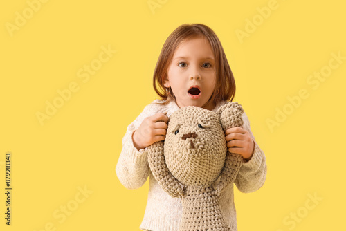 Shocked little girl with te...