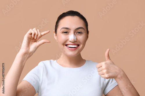 Happy young woman with band...