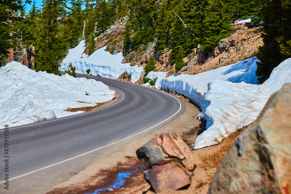 Fototapeta premium Winding Snow-Covered Mountain Road in Crater Lake National Park Eye-Level
