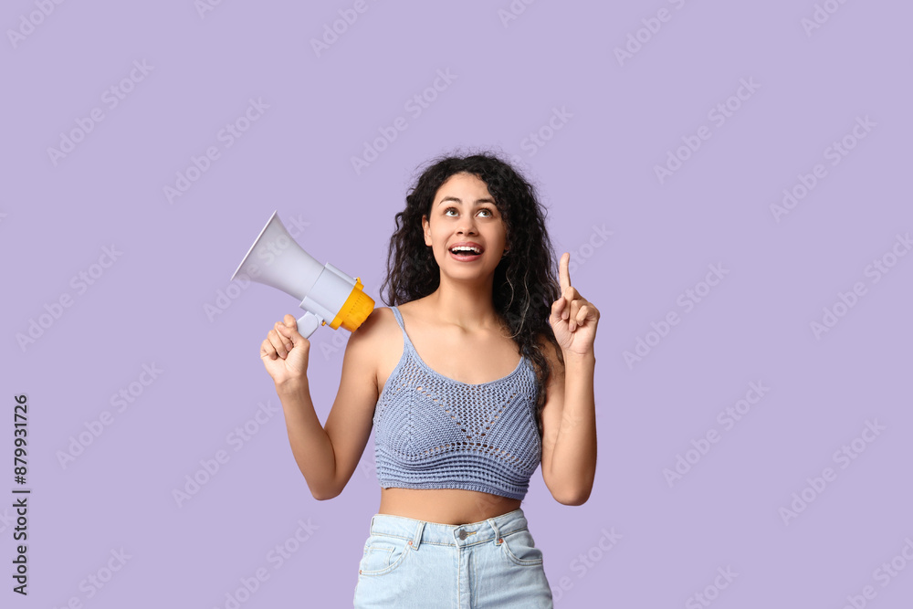 Young African-American woman with megaphone and raised index finger on lilac background Young African-American woman with megaphone and raised index finger on lilac background