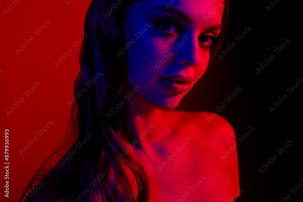 Close up cropped photo of gorgeous young girl posing bare shoulders isolated on neon red blue background