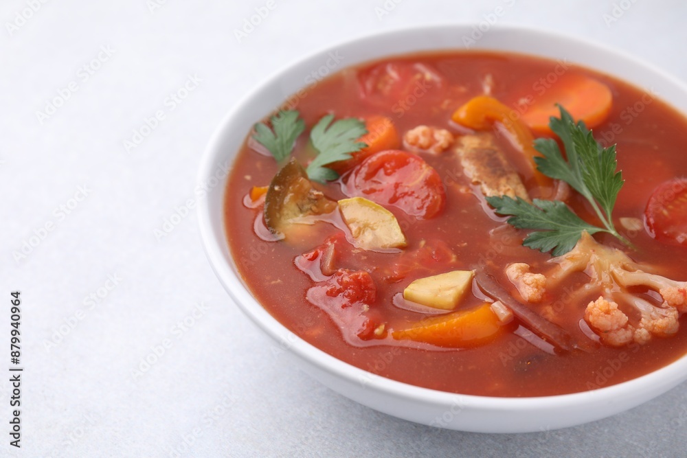 Delicious homemade stew in bowl on light table, closeup. Space for text Delicious homemade stew in bowl on light table, closeup. Space for text