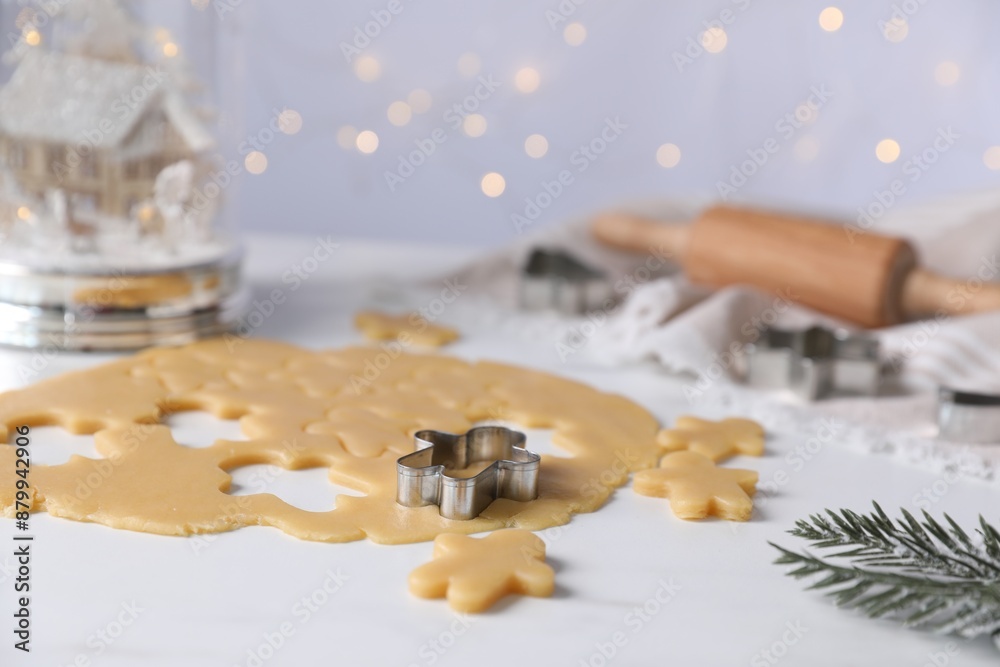 Making cookies. Raw dough and cutter on white table Making cookies. Raw dough and cutter on white table