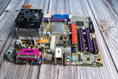 PC motherboard on a wooden table. photo