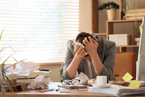 Stressed businesswoman with...