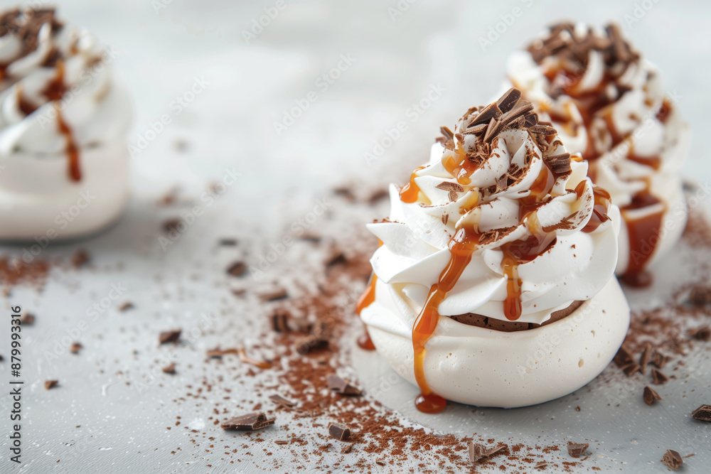 Fototapeta premium Delicate Vanilla And Chocolate Pavlovas Drizzled With Salted Caramel