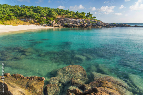 Picturesque tropical Pebbly Beach with turquoise water on Lizard Island, Australia. Lizard Island  is located on Great Barrier Reef in north-east part of Queensland photo