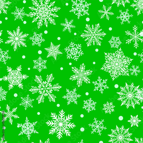 Wallpaper Mural Christmas seamless pattern of beautiful complex white snowflakes on green background. Winter illustration with falling snow. Torontodigital.ca
