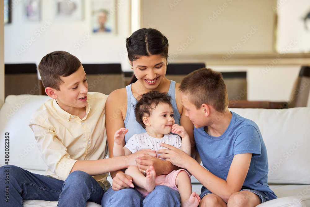 Love, mother and children or siblings on sofa in home with playing, care and bonding with baby. Happy family, woman and brothers with safety, security and support for sister in living room with relax Love, mother and children or siblings on sofa in home with playing, care and bonding with baby. Happy family, woman and brothers with safety, security and support for sister in living room with relax