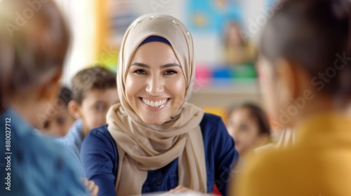 A smiling woman wearing a head scarf is surrounded by children