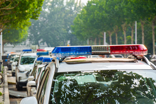 Photography Police lights on car during traffic surveillance on the city road
