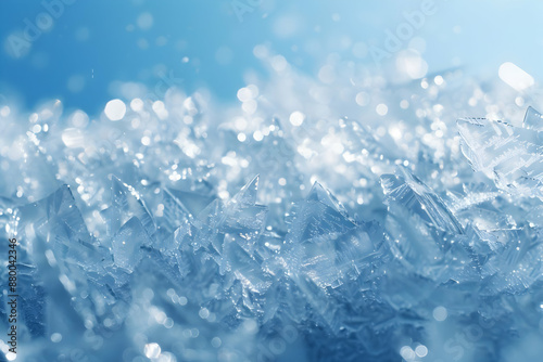 Closeup of sparkling ice crystals against a soft blue background, capturing the beauty of winter's frozen wonders in intricate detail.