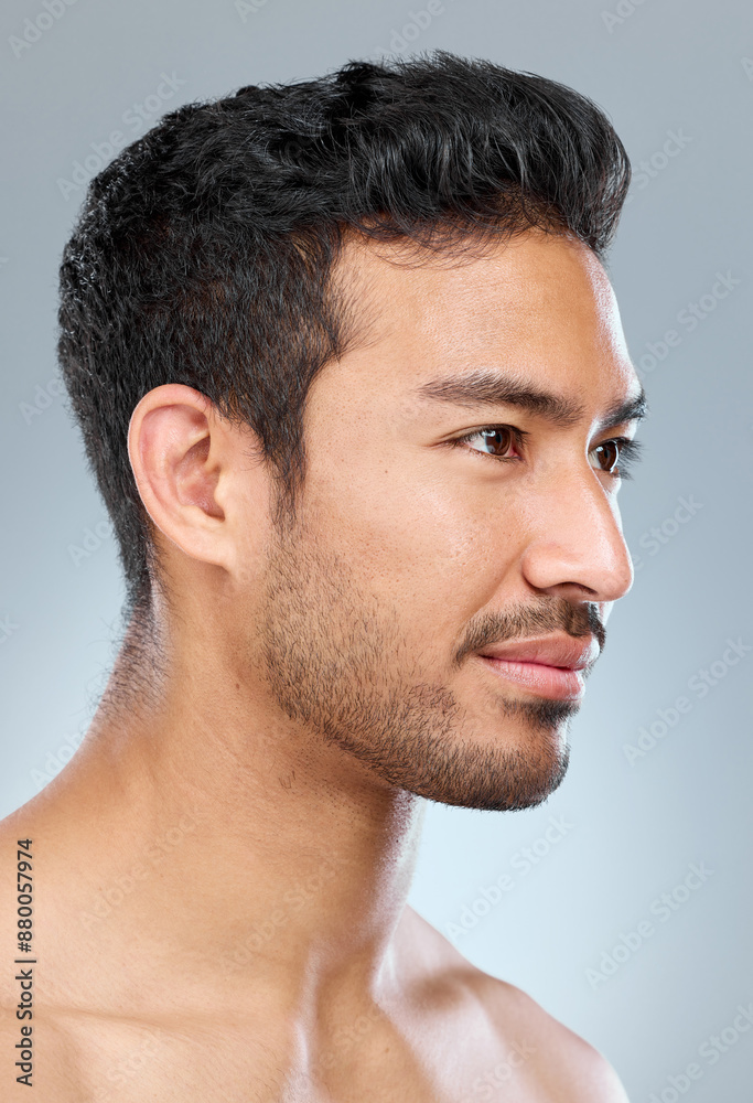 Obraz premium Male person, thinking and profile for skincare in studio with grooming, wellness and pride for glow. Man, dermatology and idea for luxury treatment, shine or routine for clean face by gray background