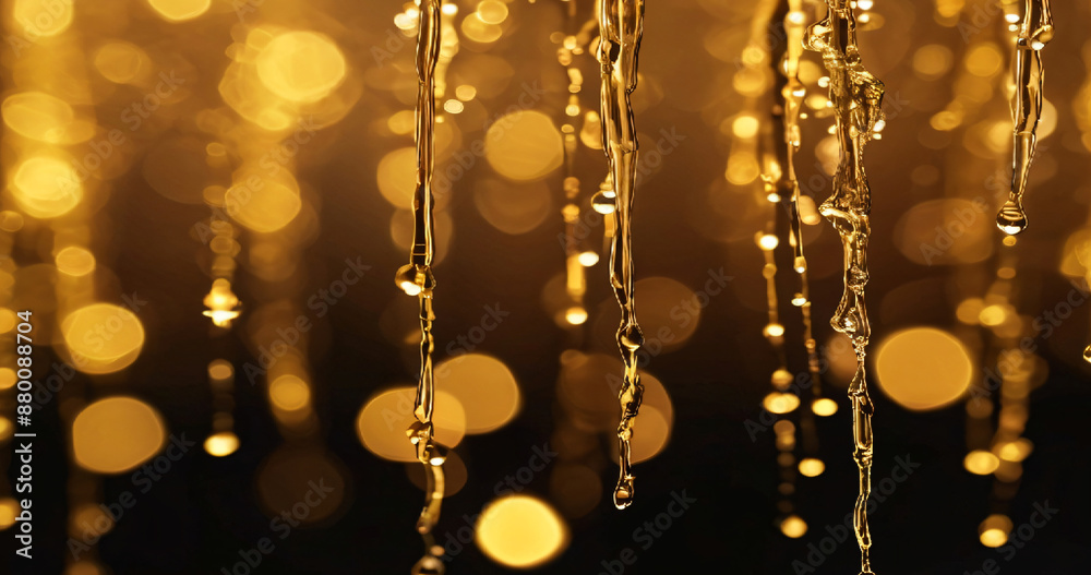 The image shows golden Christmas lights and golden Christmas balls with a bokeh effect in the background The image shows golden Christmas lights and golden Christmas balls with a bokeh effect in the background