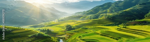 Scenic view of lush green terraced fields and rolling hills under a partly cloudy sky with sun rays streaming through in the countryside.