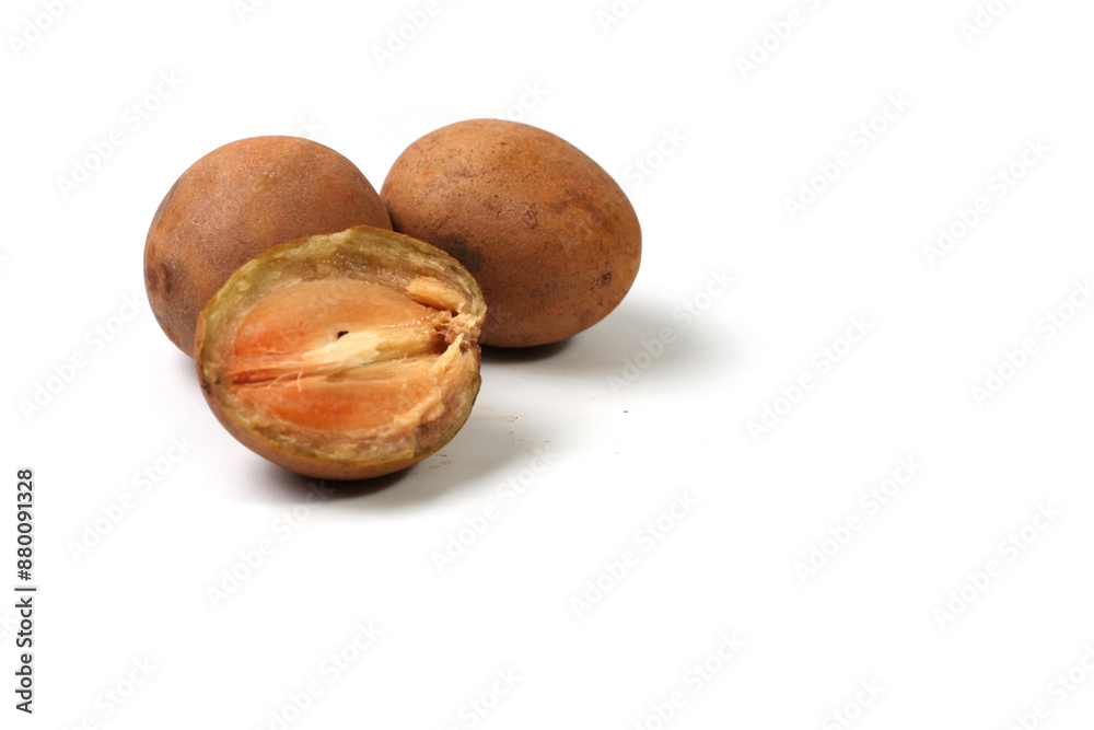 Sapodilla fruit (Manilkara zapota) and other names such as sapota, or sawo. Isolated on white background with copy space. Sapodilla is tropical fruit and sweet taste fruit. Sapodilla fruit (Manilkara zapota) and other names such as sapota, or sawo. Isolated on white background with copy space. Sapodilla is tropical fruit and sweet taste fruit.