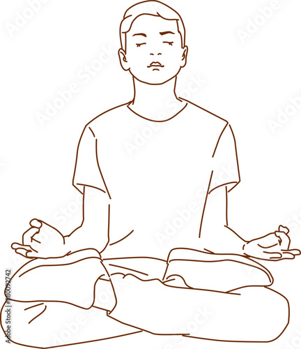 calm boy sitting on floor and meditating in lotus position practicing yoga