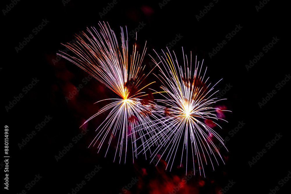 Montreal, Canada - June 27 2024: Fire works show with quarter moon in background at La Ronde in Montreal Montreal, Canada - June 27 2024: Fire works show with quarter moon in background at La Ronde in Montreal