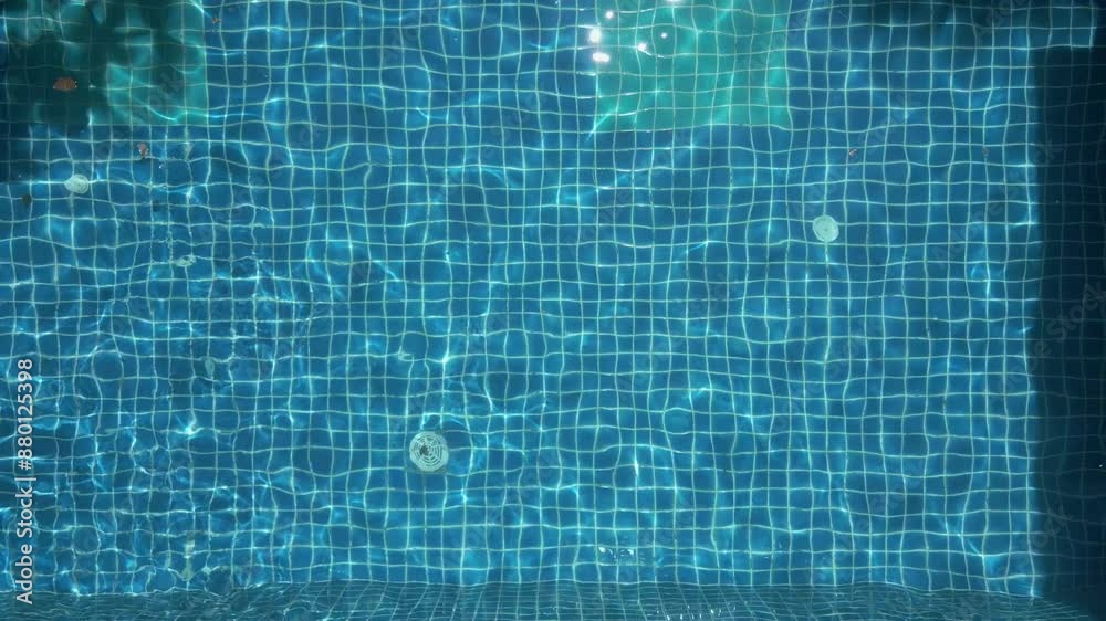 Aerial view of blue water in the pool with light reflections Aerial view of blue water in the pool with light reflections
