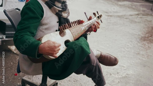 Man Playing music instrument on road