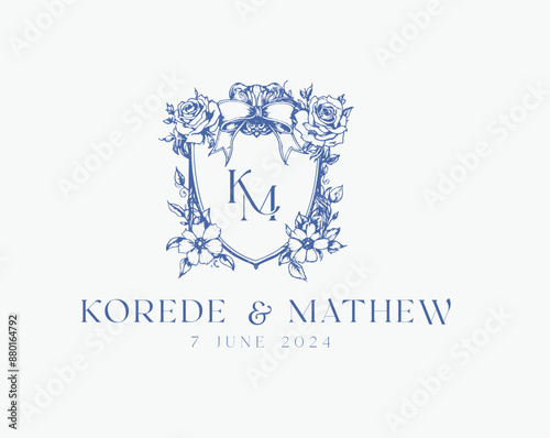 Wedding logo crests vector design royal style blue color illustration monogram crest design with KM initial surrounded by baroque style intricate motifs