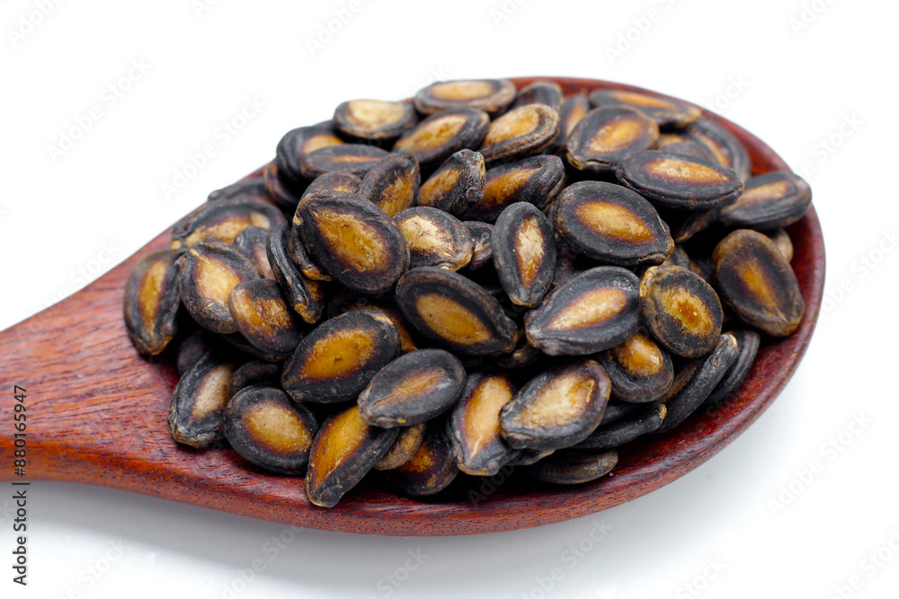 Roasted watermelon seeds on white background.