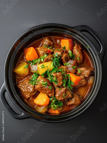 Hot chicken stew with vegetables and rice in a white bowl