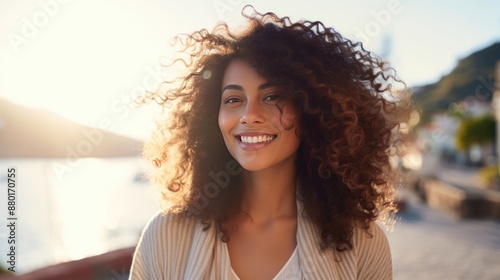 Young Hispanic woman with curly hair, 