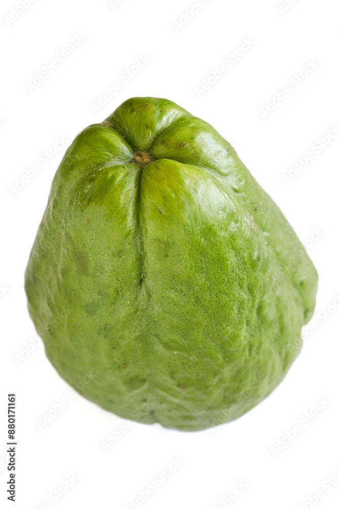 A close up shot of a fresh choko (chayote) fruit on white background.