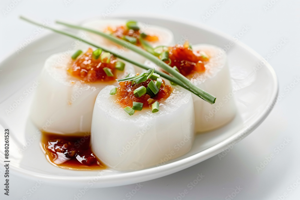 a plate of scallops with sauce and scallions a plate of scallops with sauce and scallions