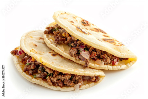 two tacos sitting on top of each other on a white surface photo