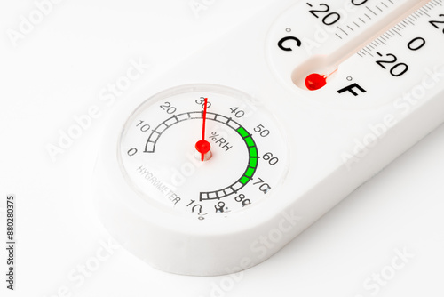 White Thermometer and Hygrometer Displaying Room Temperature and Humidity photo