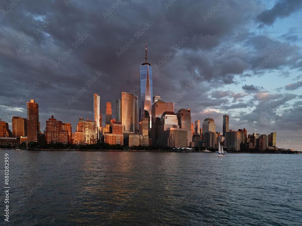 Obraz premium New York City top view. NYC aerial view, New York City Skyline with dramatic sky. Panoramic drone view on Manhattan in NY. Night in NYC. New York City Midtown skyline view at dusk with clouds.