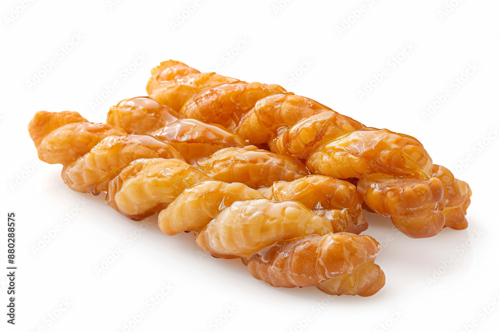 a pile of doughnuts on a white surface