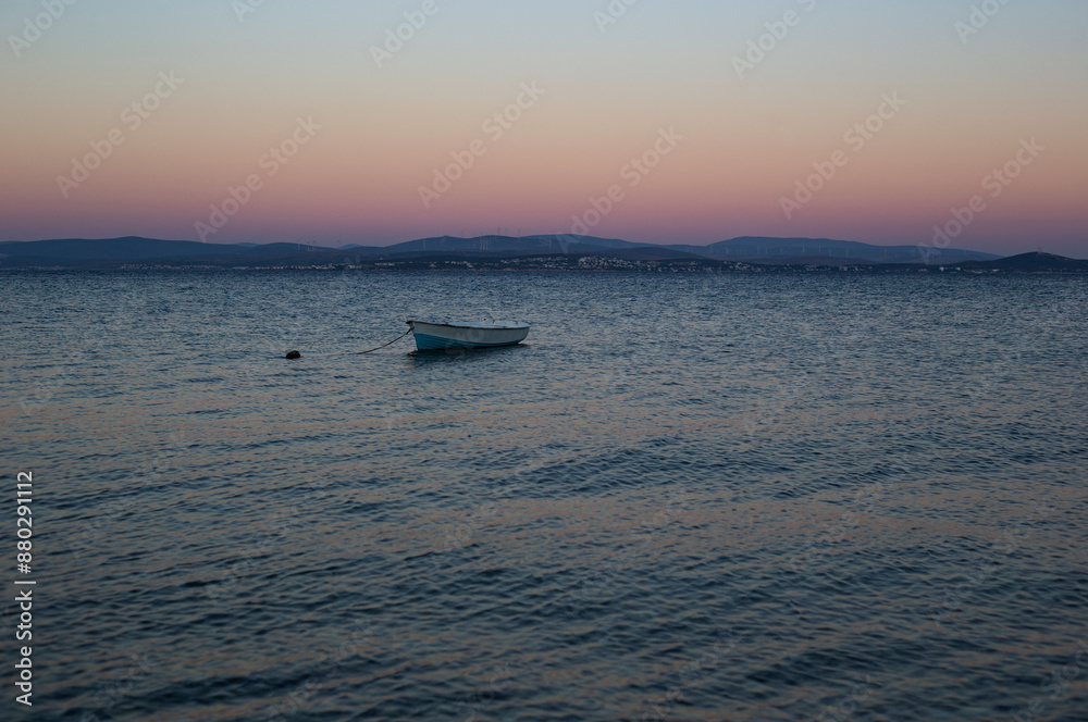 Solitary boat at sunset beautiful landscape Solitary boat at sunset beautiful landscape