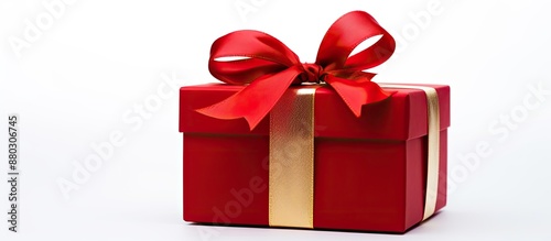 Gift box in red with ribbon, displayed on a white background, ideal for copy space image