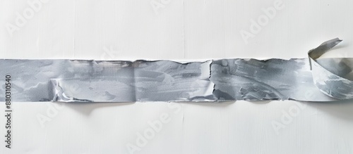 Detailed close-up view of gray scotch tape with a white background, ideal for copy space image. photo