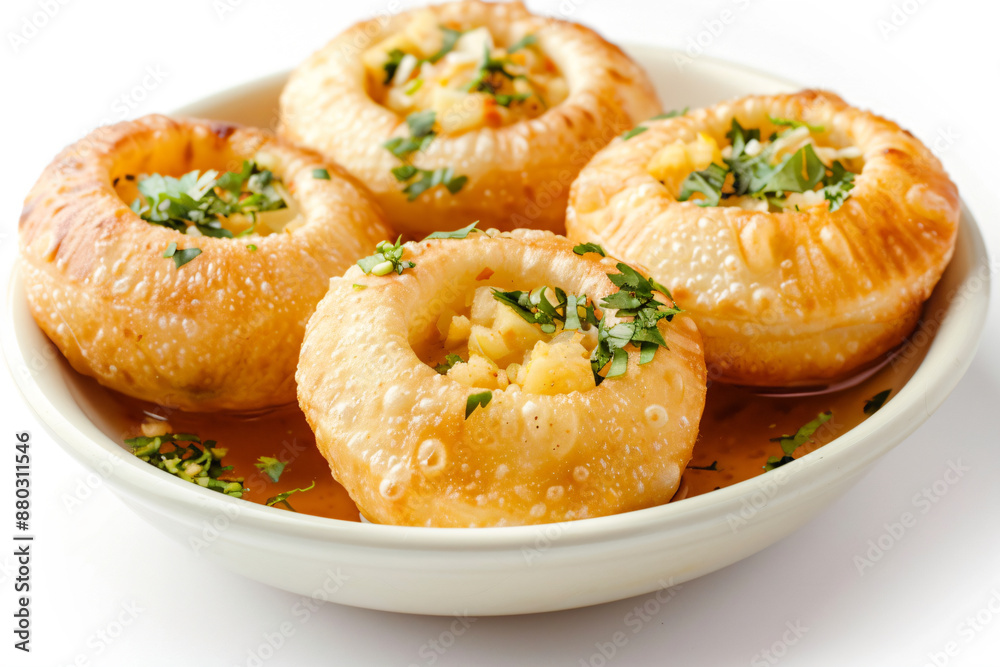 a bowl of baked bread with a sprinkled parsley