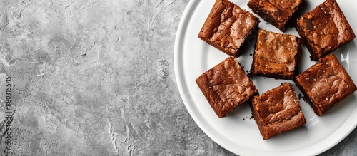 Brownies placed on a white plate with copy space image. photo