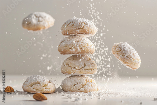 a pile of cookies with powdered sugar falling off of them photo