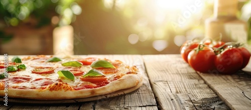 A pizza sitting on a table ...