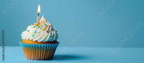 A birthday cupcake sits ato...