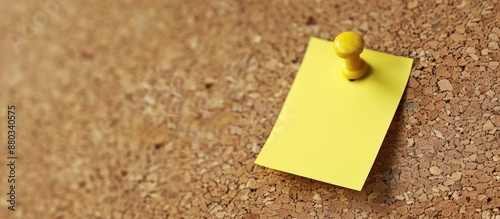 A yellow memo pinned on a c...