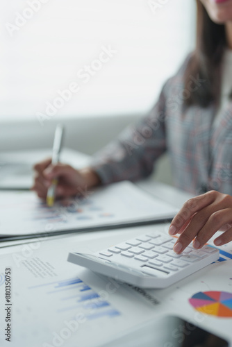Wallpaper Mural Confident Asian businesswoman working on laptop in modern office Accountants take care of finances, experts analyze business reports. Budget calculations on business growth files. Torontodigital.ca