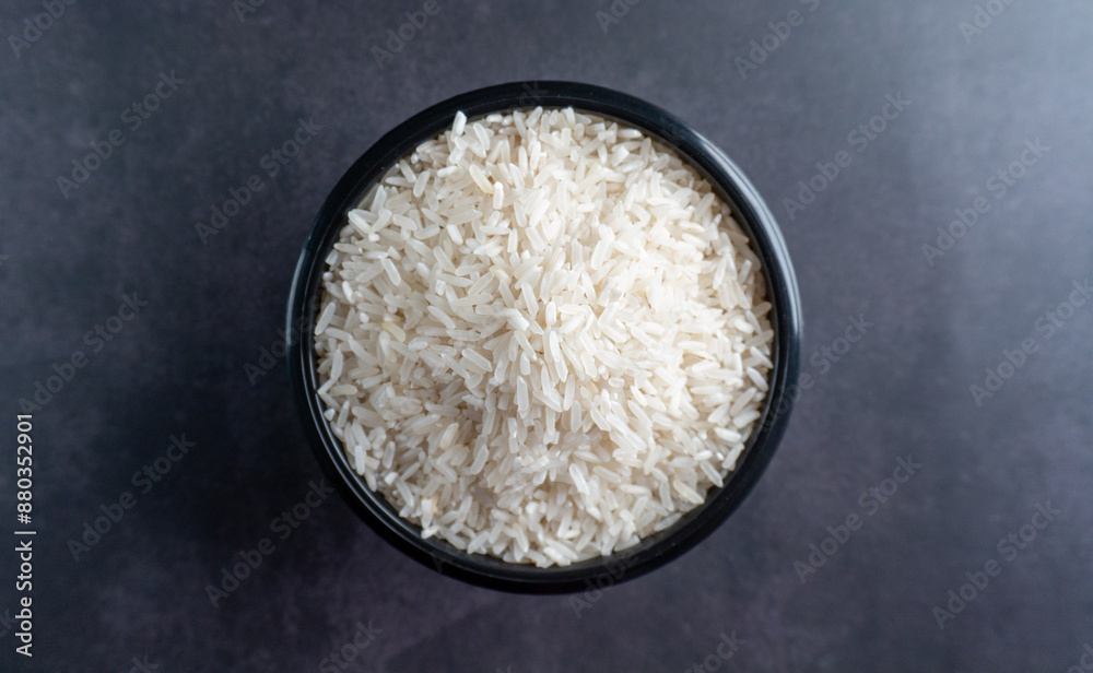 top view a bowl of rice on stone table top view a bowl of rice on stone table