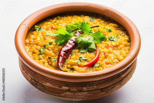 a bowl of food with a chili and corianto