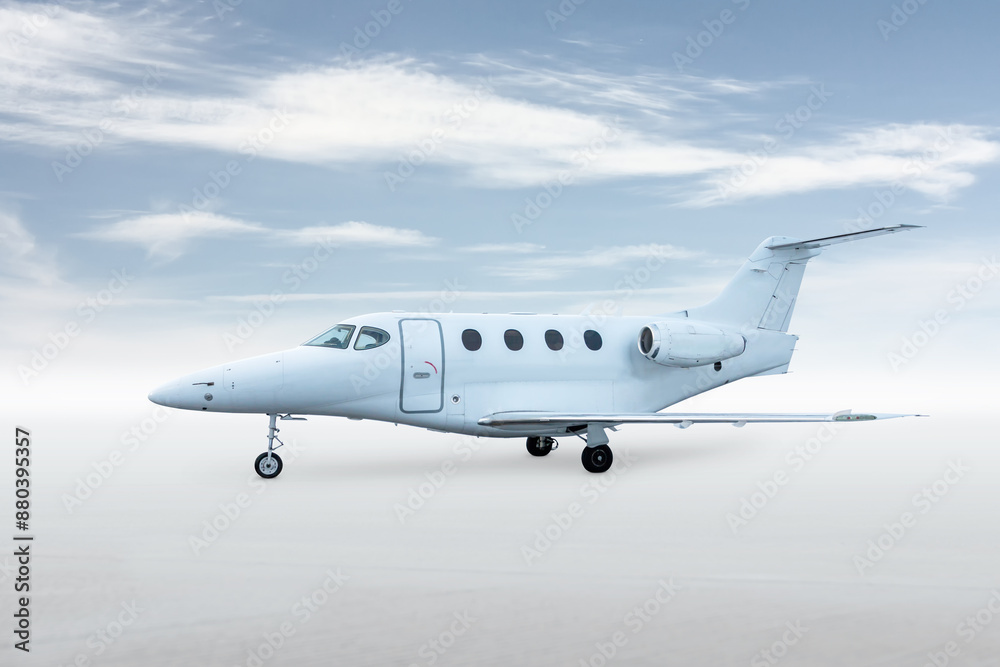 Obraz premium Modern white corporate aircraft isolated on bright background with sky