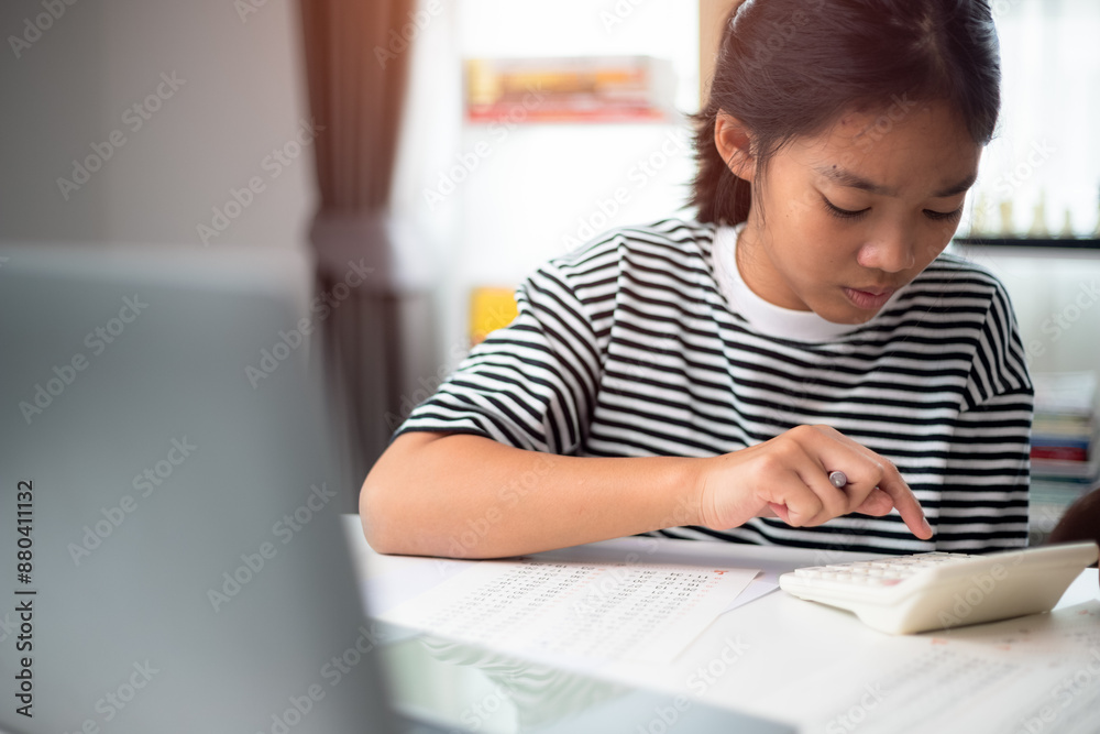 Little girl doing math task in classroom Little girl doing math task in classroom