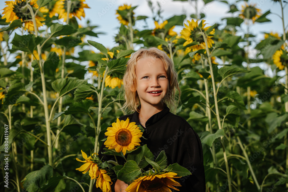 Child girl in a field with sunflowers, cute and funny Child girl in a field with sunflowers, cute and funny